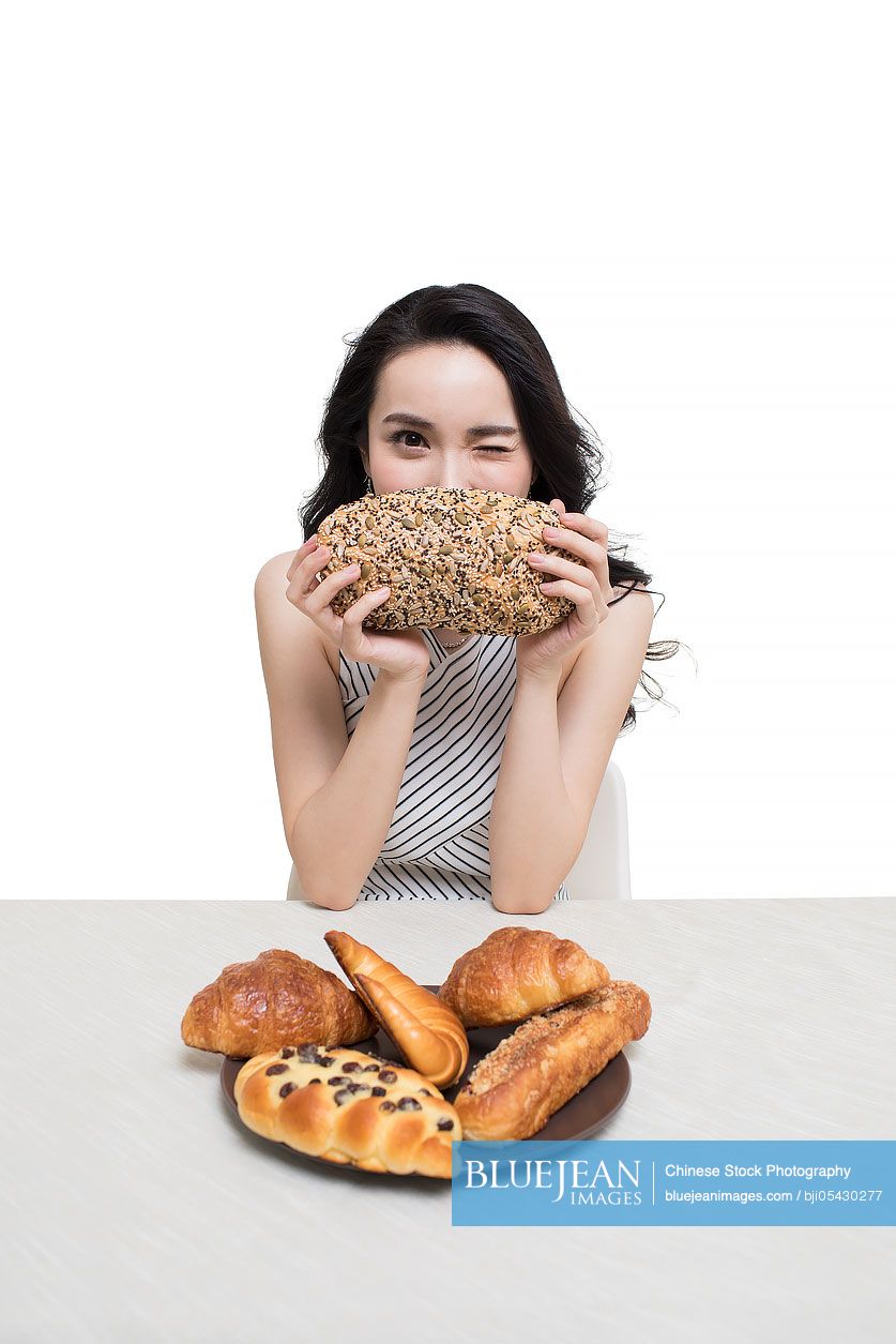 Fashionable young Chinese woman and bread