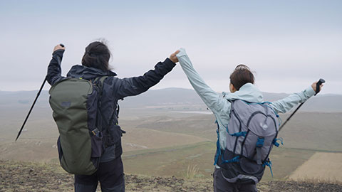 Happy Chinese couple hiking outdoors,4K