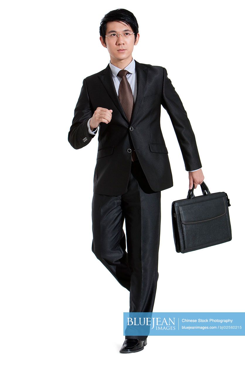Portrait of Chinese businessman walking