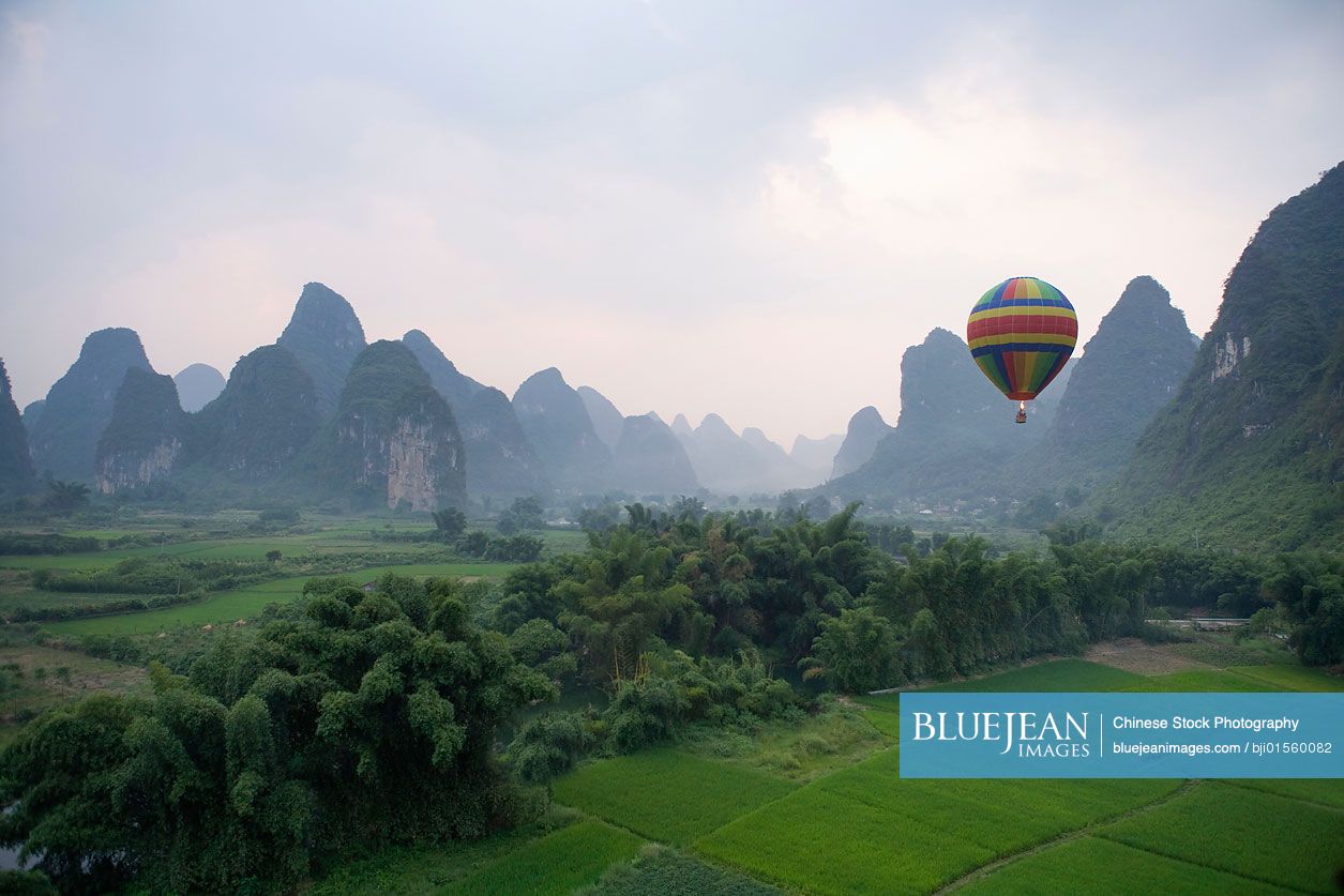 Hot air balloon flying above the Guilin Hills