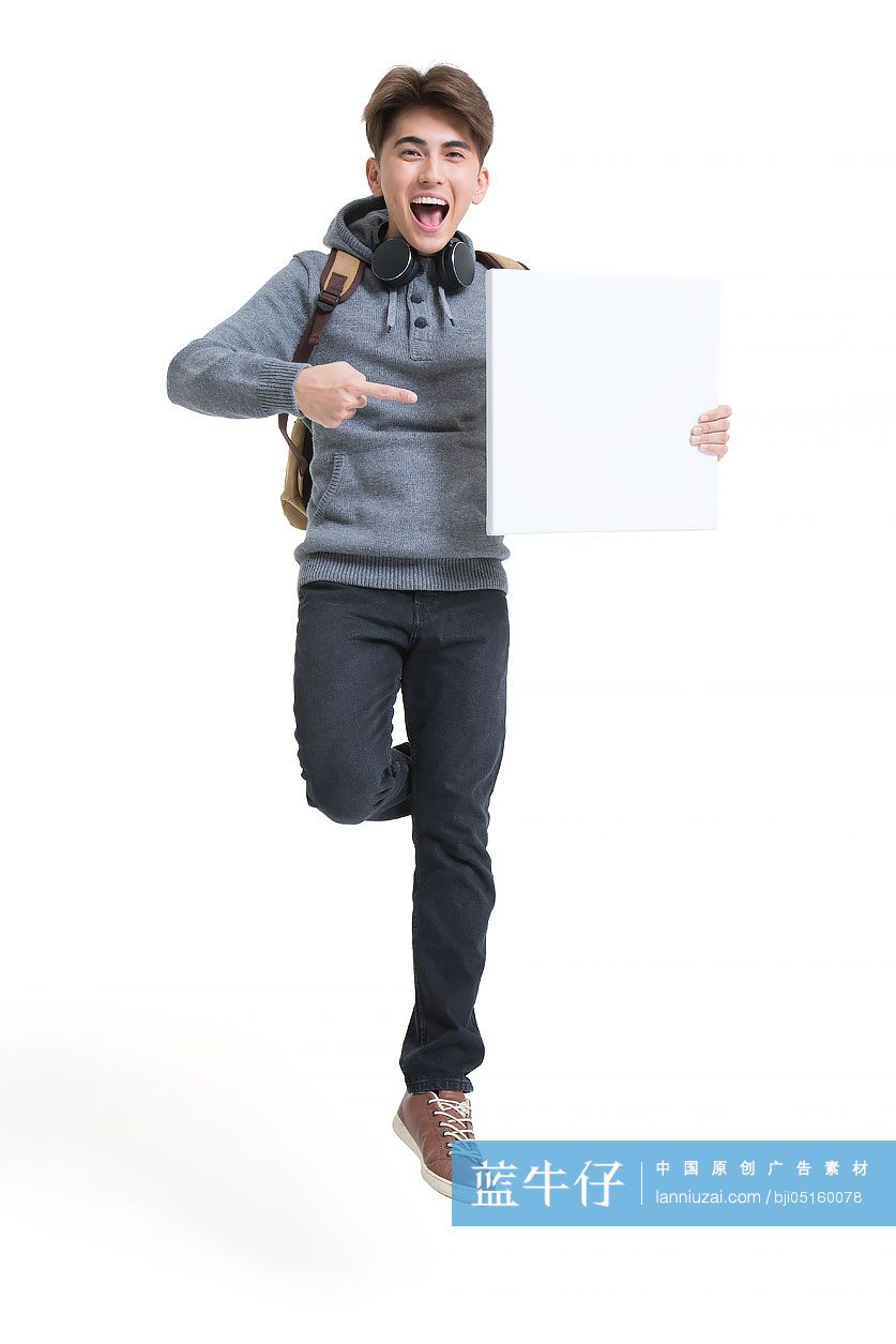 开心的男大学生展示白板 蓝牛仔影像 中国原创广告影像素材