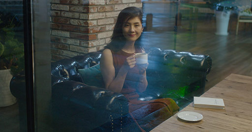 Elegant Chinese woman reading book in coffee shop,4K