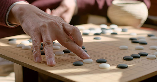Chinese father and son playing the game of go,4K