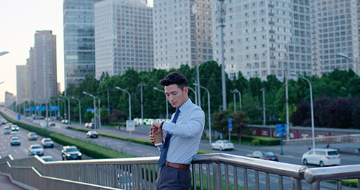 Young Chinese businessman checking the time,4K