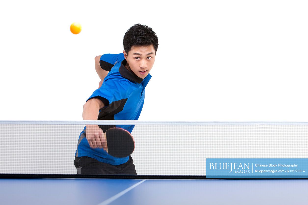 Chinese table tennis player hitting ball