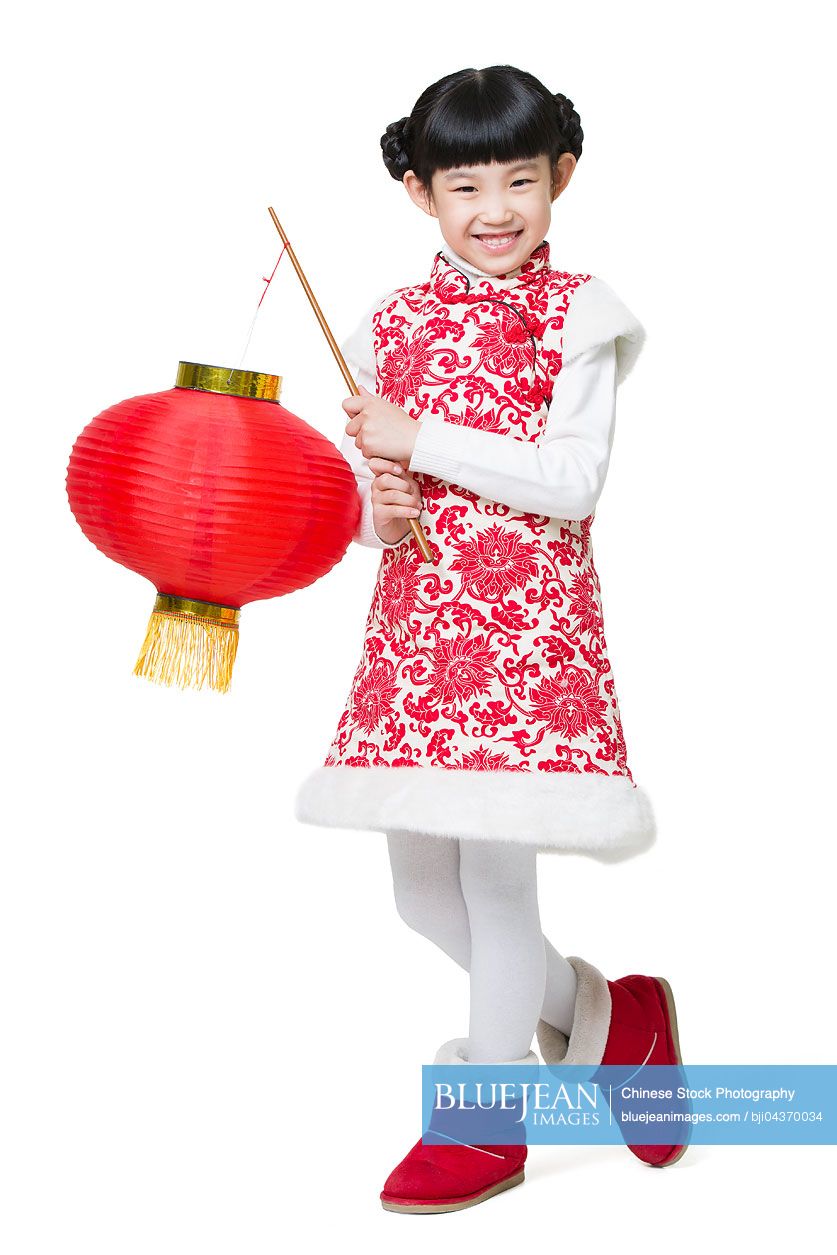 Happy girl celebrating Chinese new year with traditional lantern