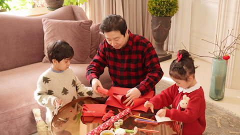 Family joyfully celebrating Chinese New Year together
