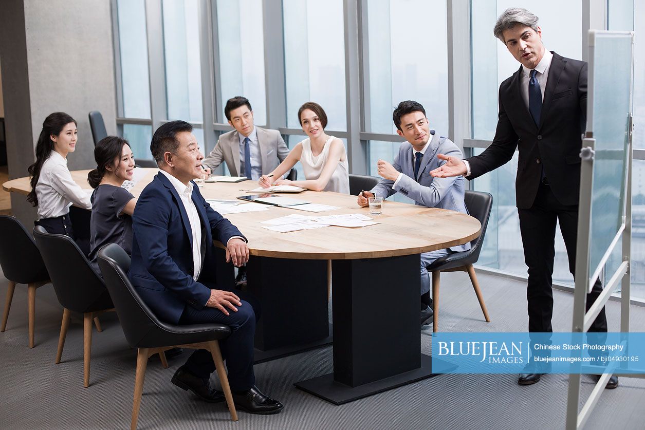 Business people having meeting in board room