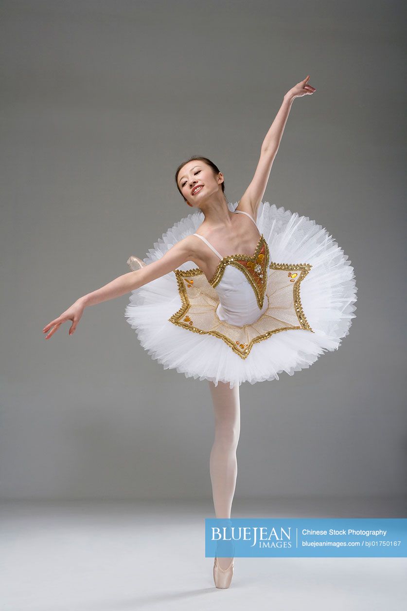 Chinese ballerina performing in a white tutu