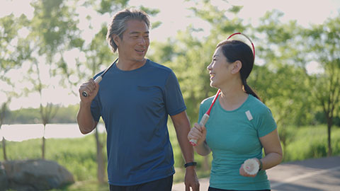 Chinese couple playing badminton
