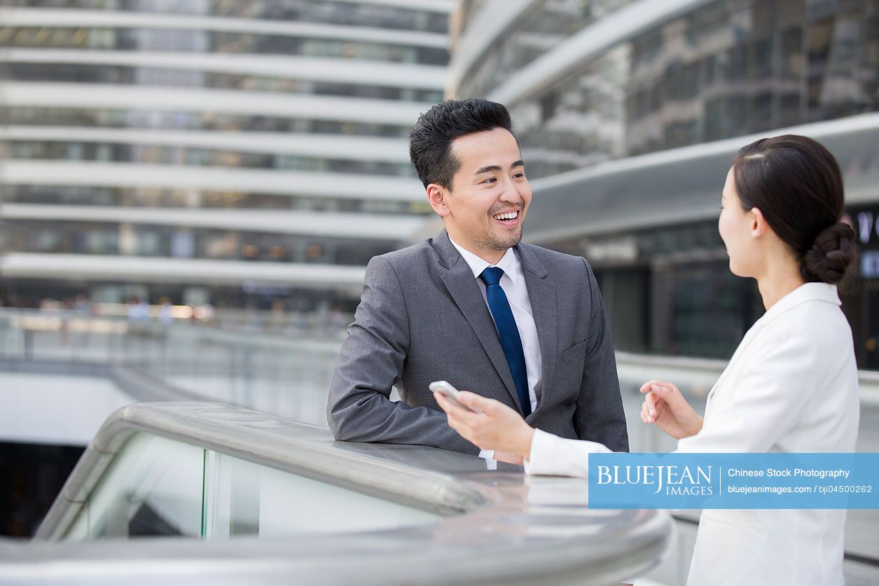 Chinese business person talking outdoors