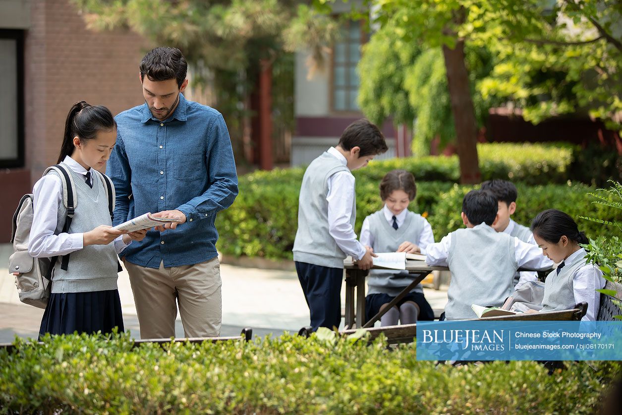 Teacher and students on campus