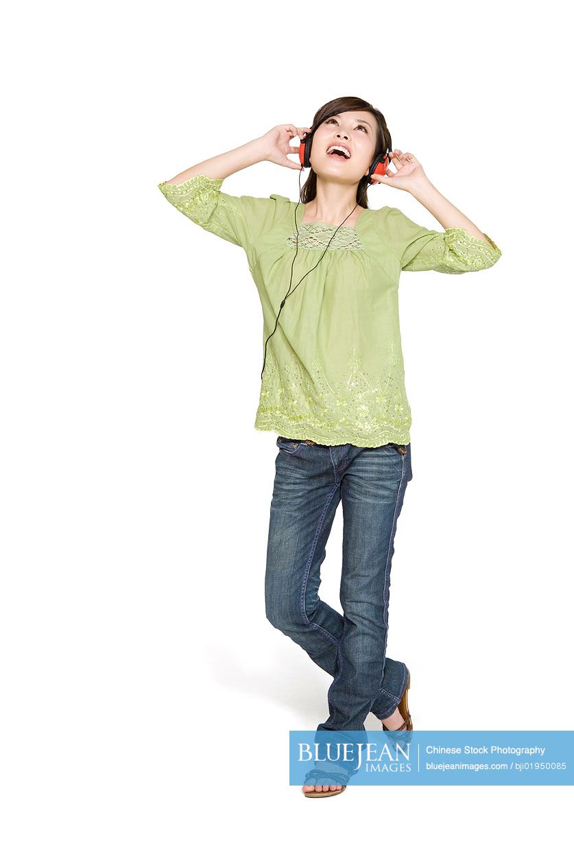 Portrait of young Chinese woman with headphones