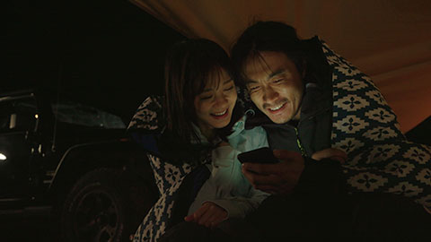 Happy Chinese couple camping outdoors,4K