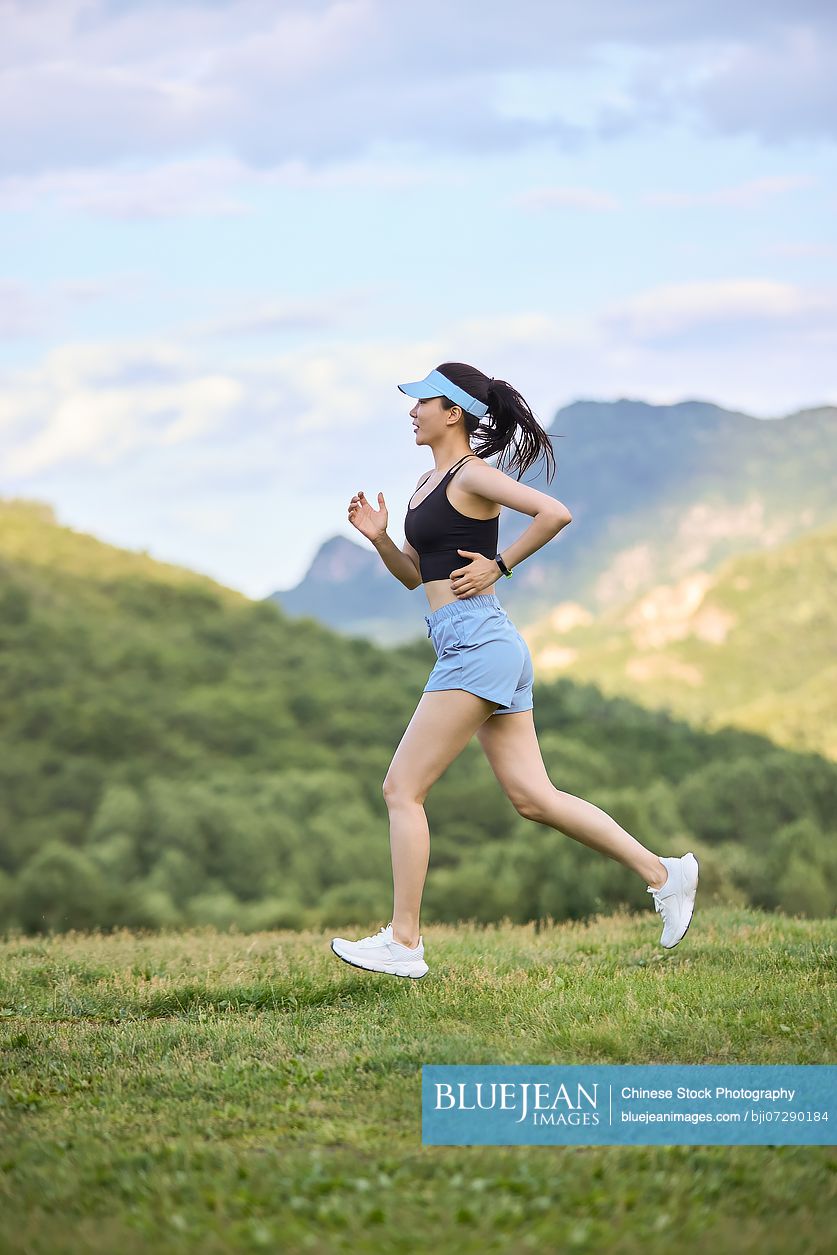 Young woman exercising in the heart of nature embracing the fresh air and natural surroundings