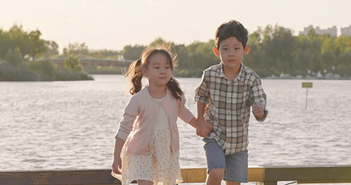 Happy Chinese children relaxing in park,4K