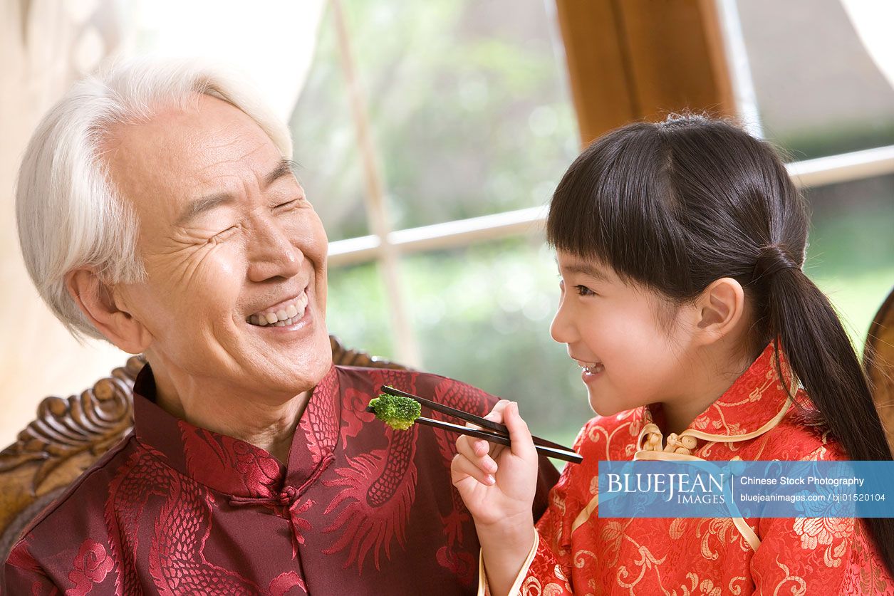 Happy moment between Chinese granddaughter and grandfather