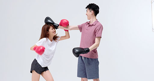 Humorous young Chinese couple practicing boxing,4K