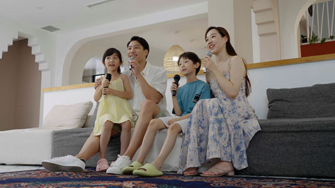 The family is enjoying their vacation and having fun at the hotel