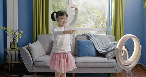 Little girl dancing on a live stream