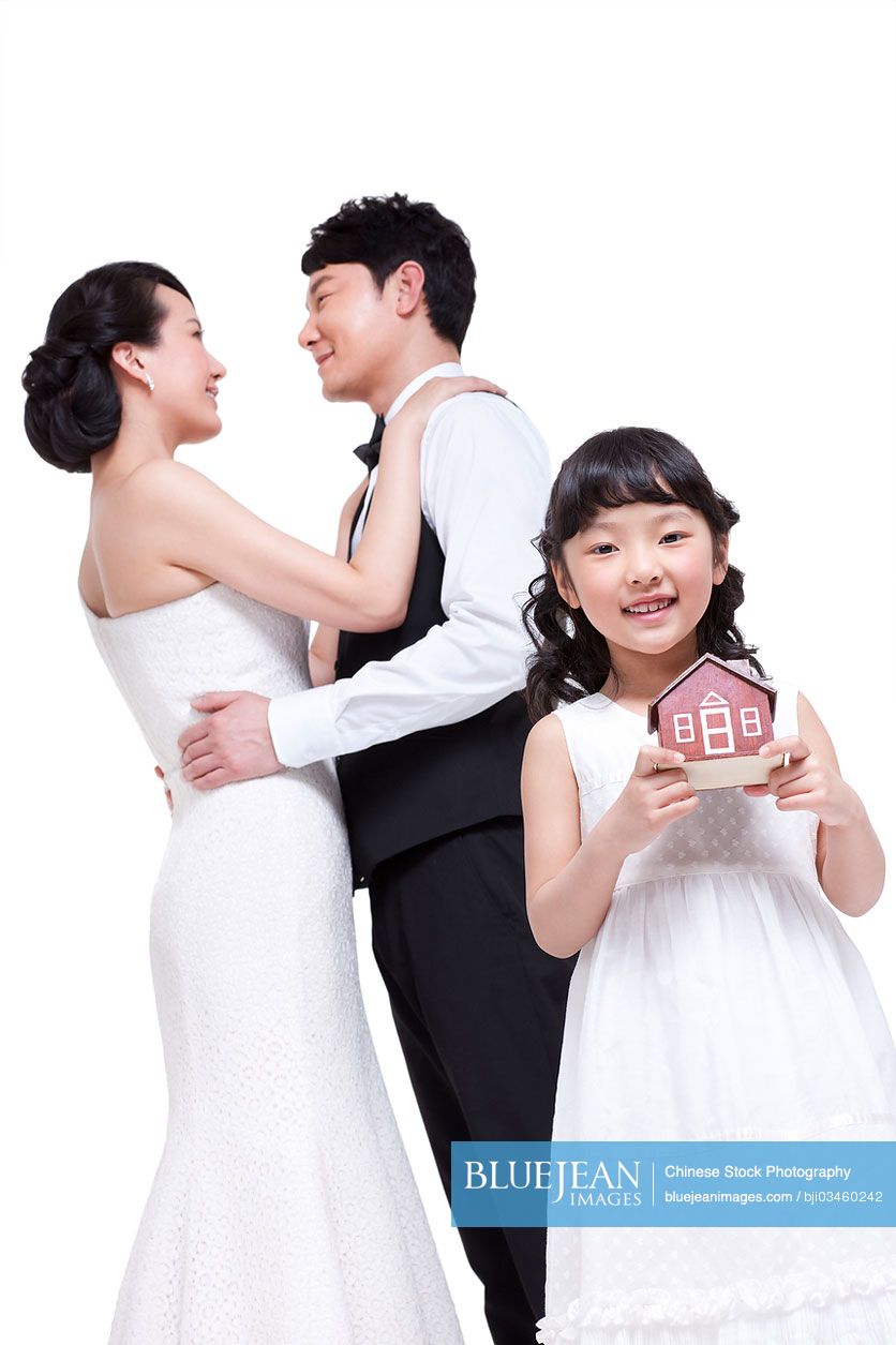 Elegant Chinese family with house model