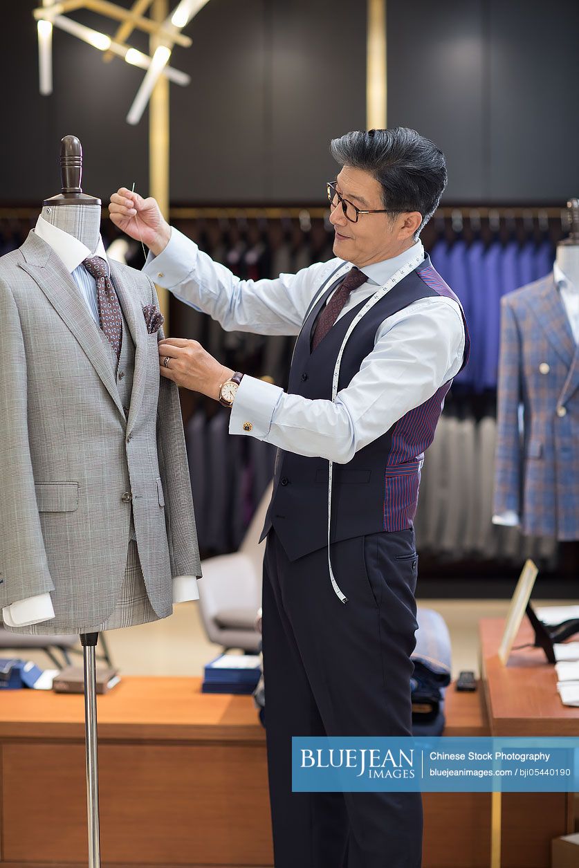 Confident Chinese fashion designer working