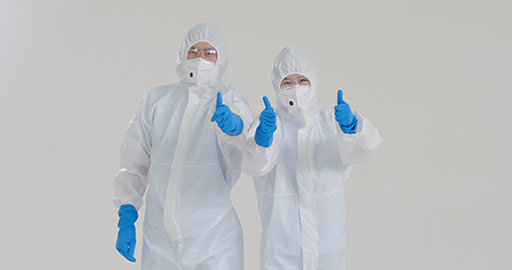 Chinese medical workers in protective suit doing thumbs-up,4K