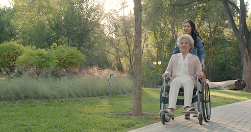 Happy Chinese mother and daughter relaxing in park,4K