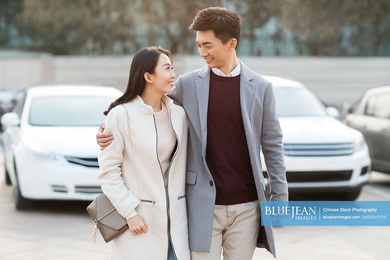 Cheerful young Chinese couple dating