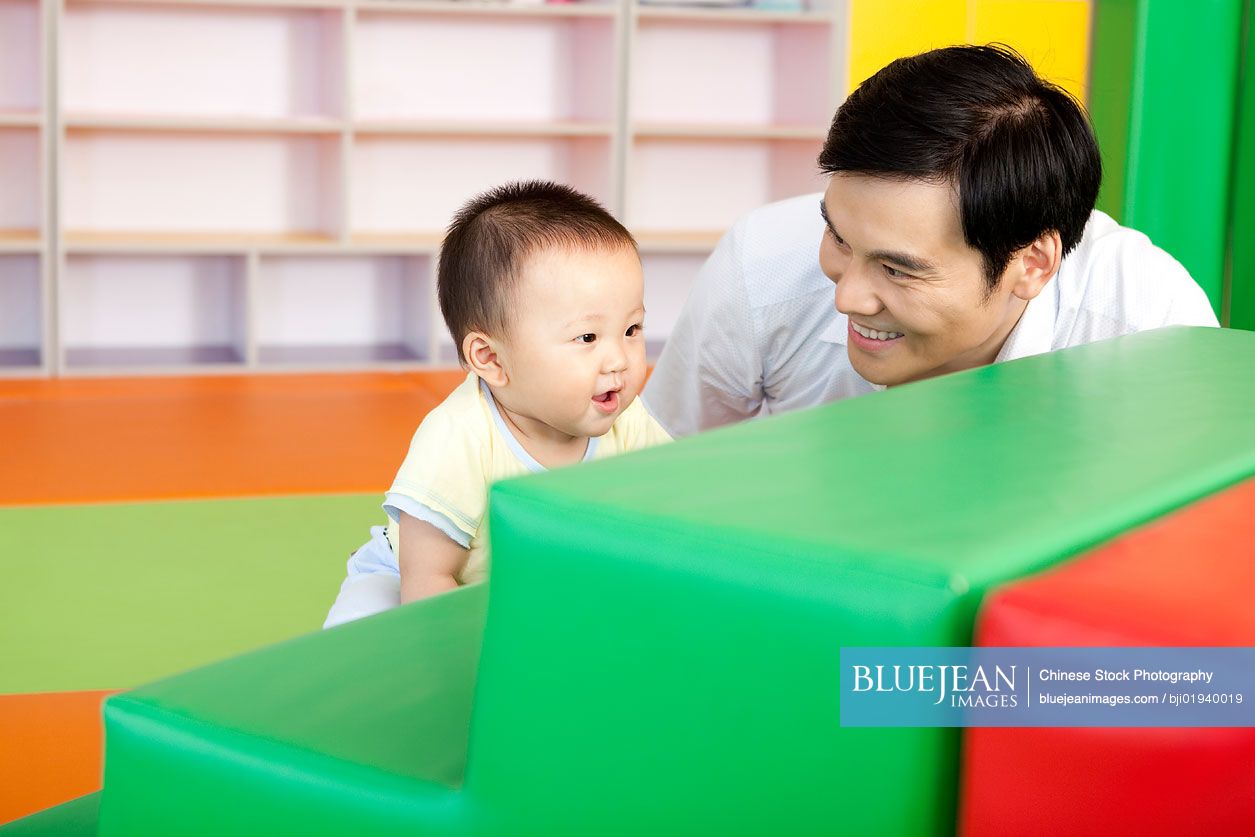 Chinese father playing with son