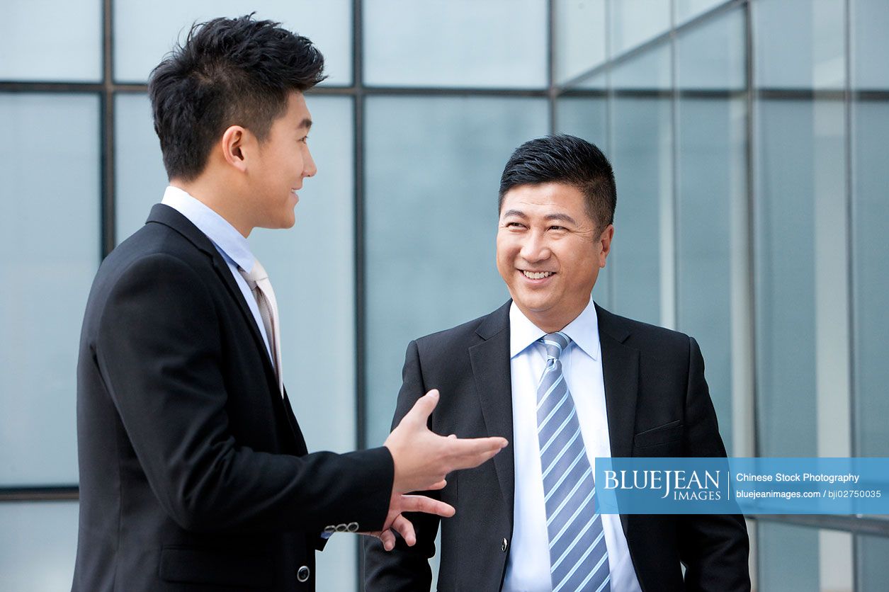 Smiling Chinese businessmen