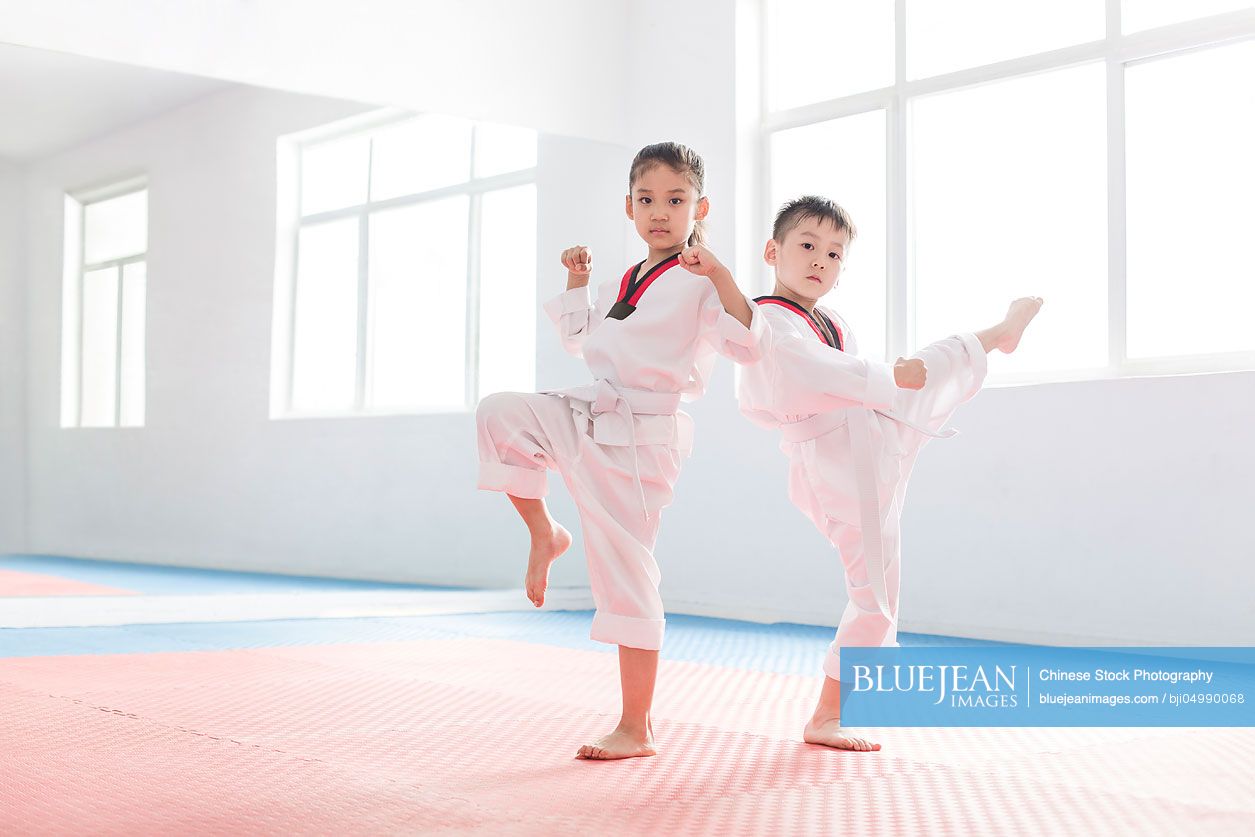 Little Chinese children practicing Tae Kwon Do