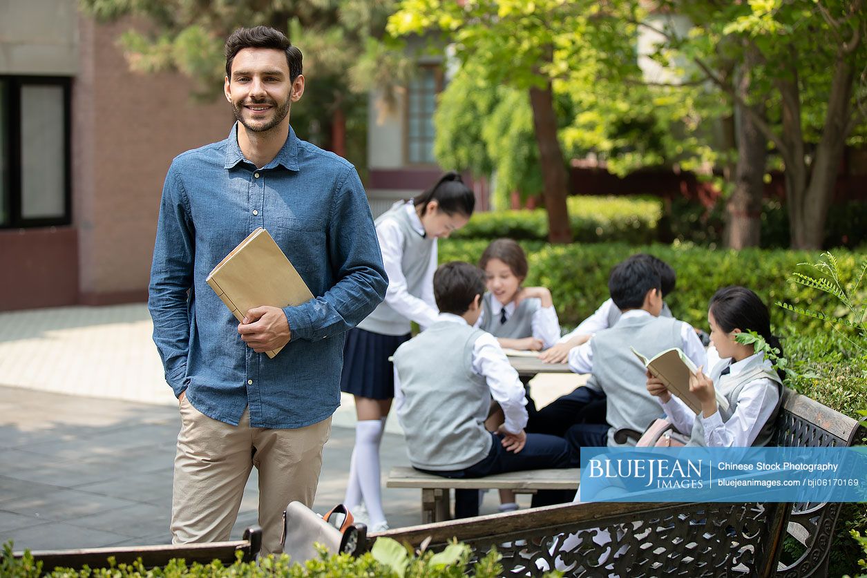 Teacher and students on campus