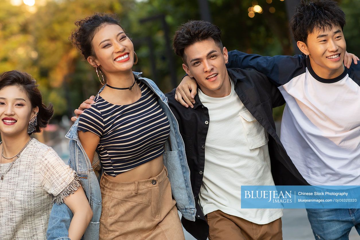 Fashionable young Chinese people having fun on street