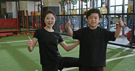 Cute Chinese boy and coach doing thumbs up,4K