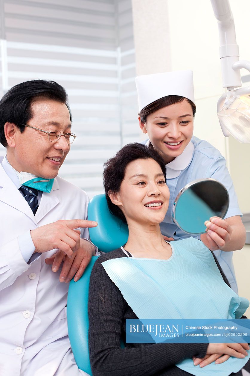 Chinese patient receiving treatment in dental clinic