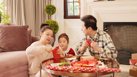 Family joyfully celebrating Chinese New Year together