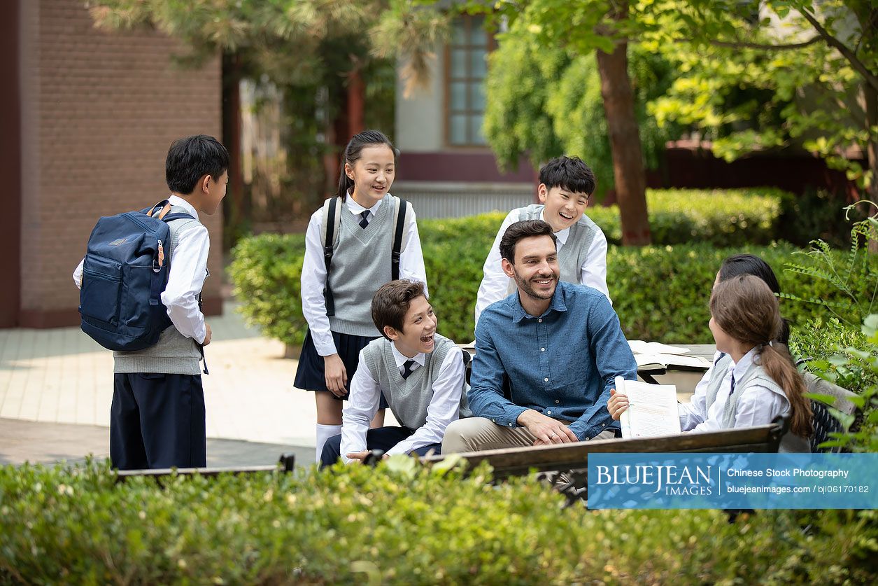 Teacher and students on campus