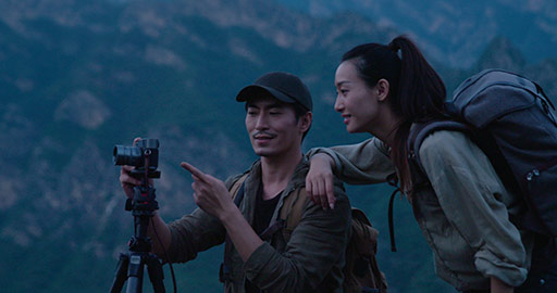 Young Chinese couple taking photos with camera outdoors,4K