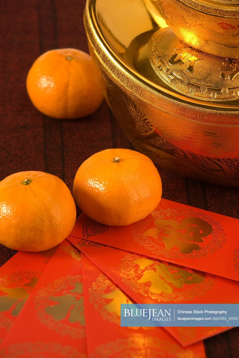 Gold Yuanbao Ingot With Red Packets And Mandarin Oranges