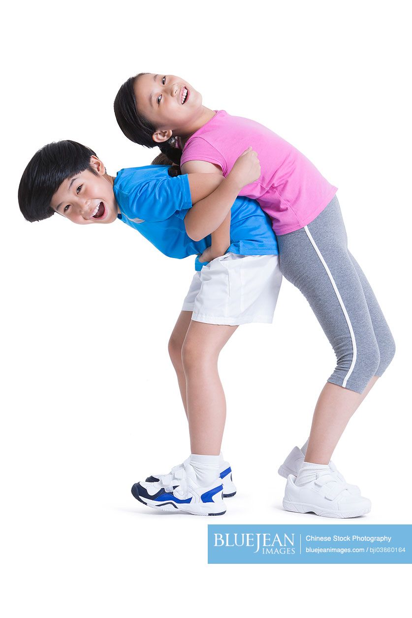 Excited Chinese boy and girl playing