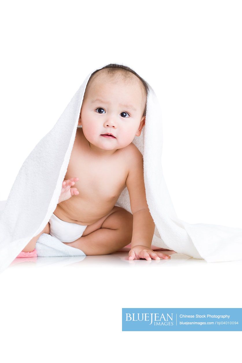 Cute Chinese baby boy wrapped in towel