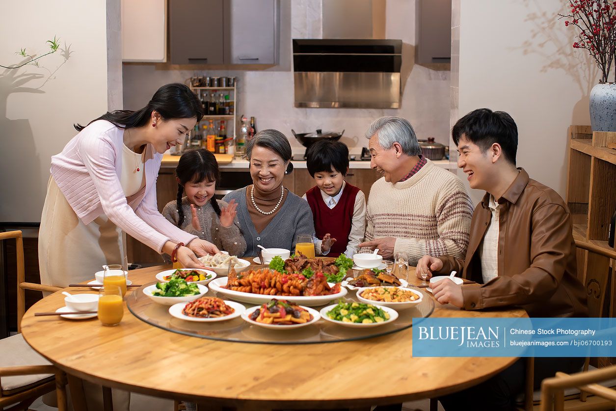 Happy family having Chinese New Year dinner