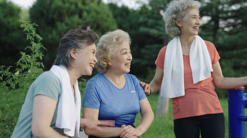 Happy senior Chinese friends relaxing in park,4K