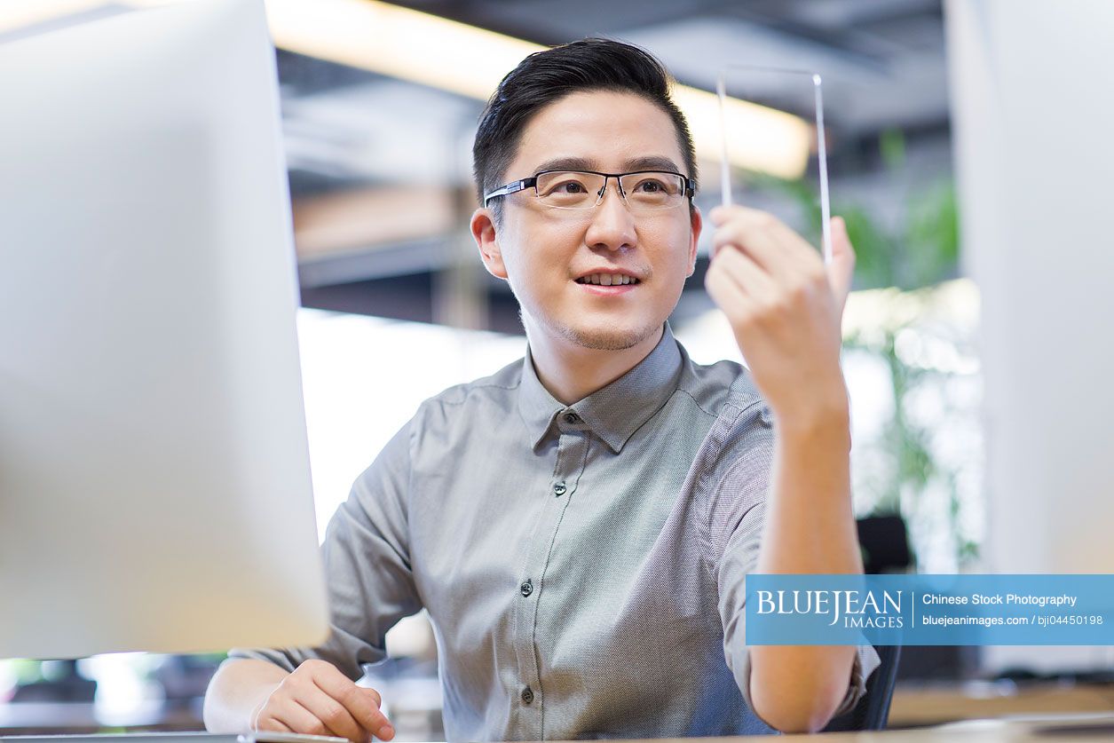 Chinese IT worker developing smart phone