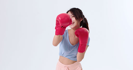 Cute young Chinese woman practicing boxing,4K