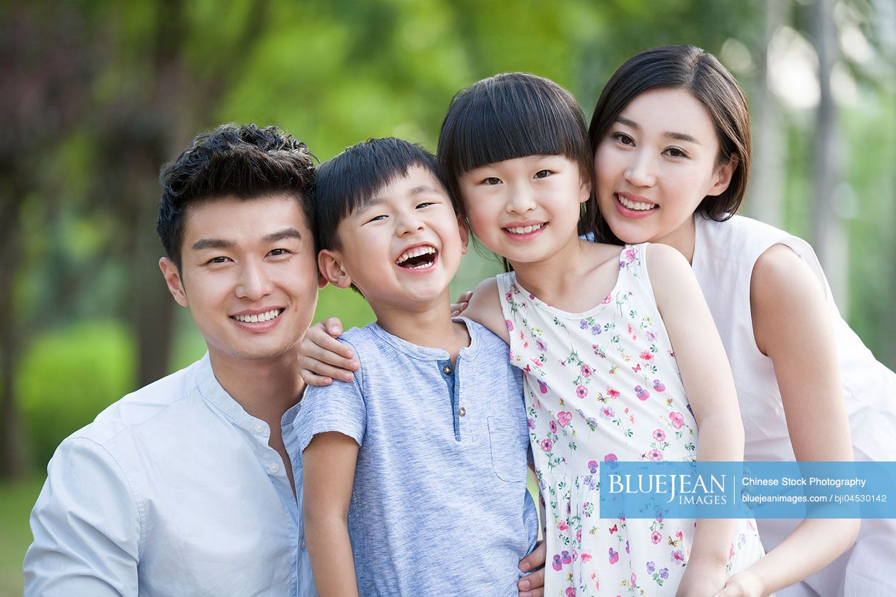 Portrait of happy young Chinese family