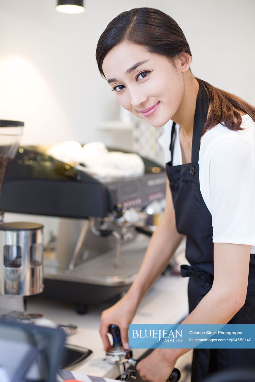 Chinese barista making coffee