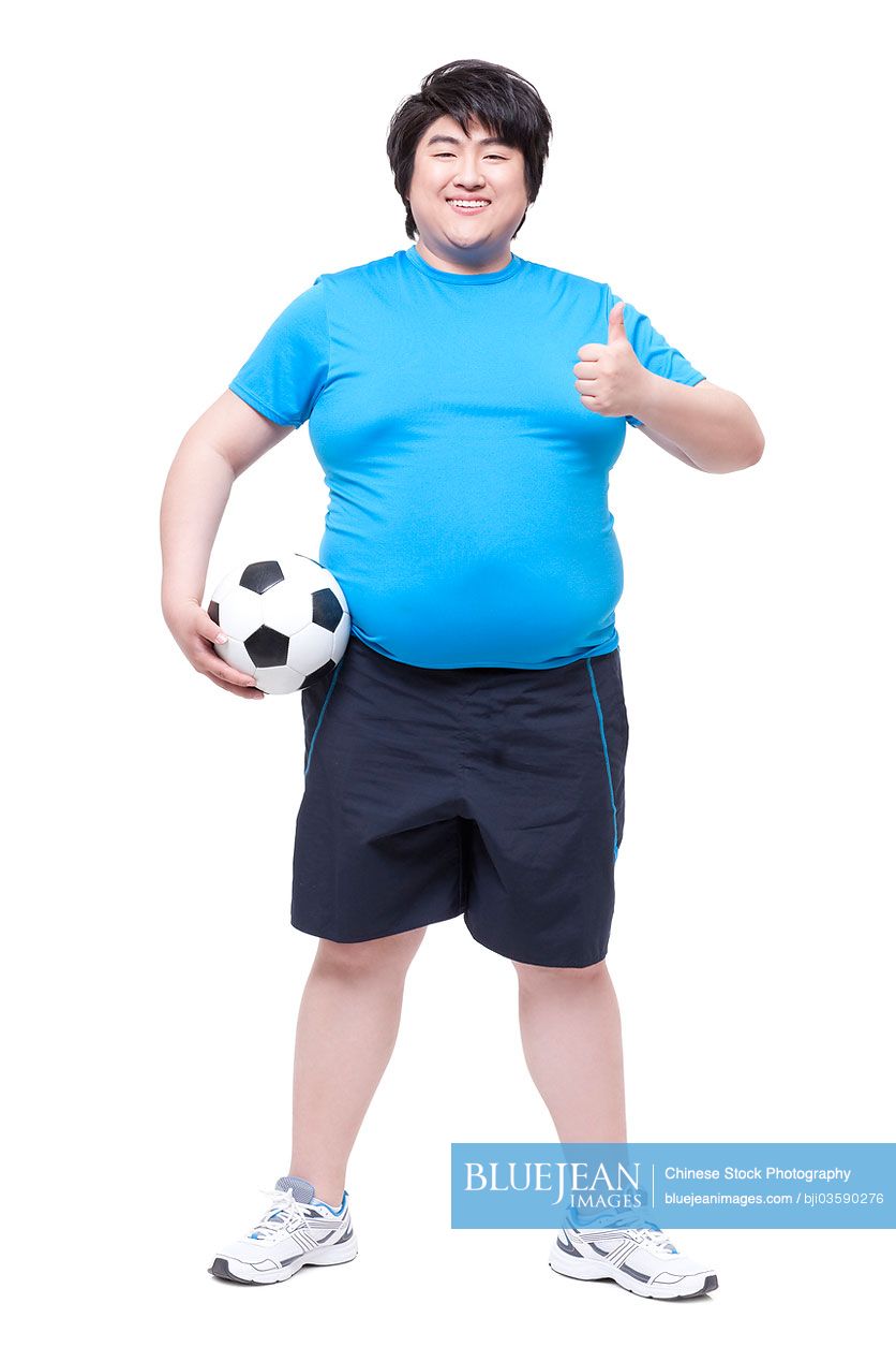 Overweight man with football