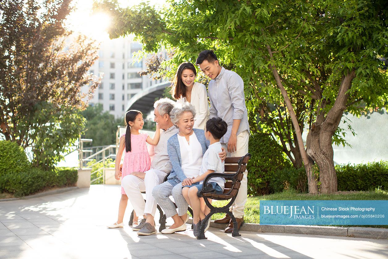 Happy Chinese family relaxing in nursing home